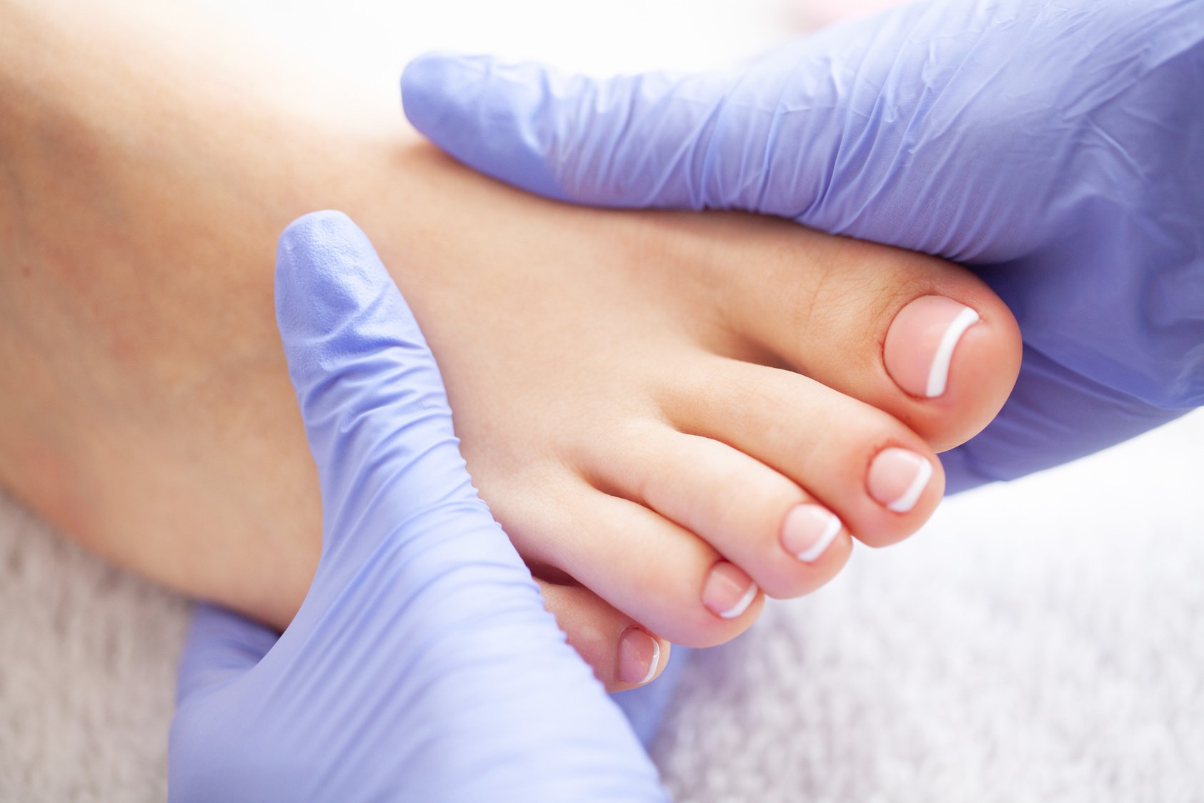 Pedicure Day. Pedicure Specialist Works With the Patient in Spa Salon